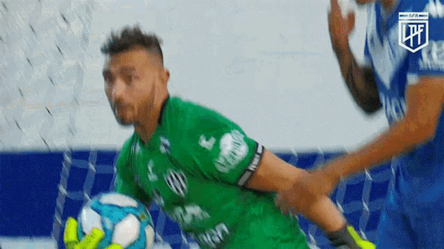 a soccer player wearing a green jersey that says ' lpfl ' on it