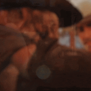 a blurry picture of a man wearing a white hat