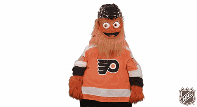 a mascot is wearing a flyers jersey and the nhl logo is behind him