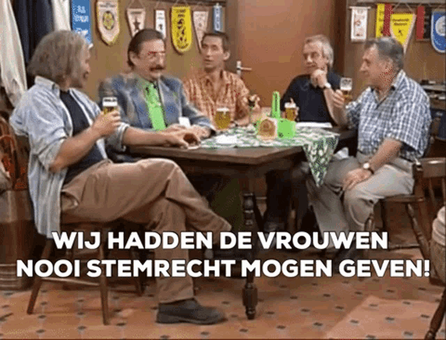 a group of men are sitting around a table with a sign that says wij hadden de vrouwen