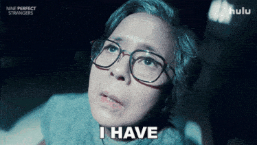 an advertisement for nine perfect strangers shows a woman with glasses