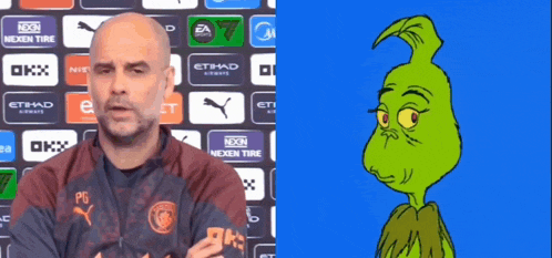 a man in a manchester city shirt is next to a grinch cartoon