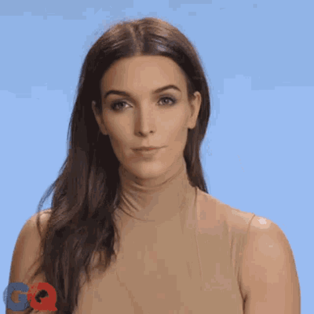 a woman with a ring on her finger is making a middle finger gesture
