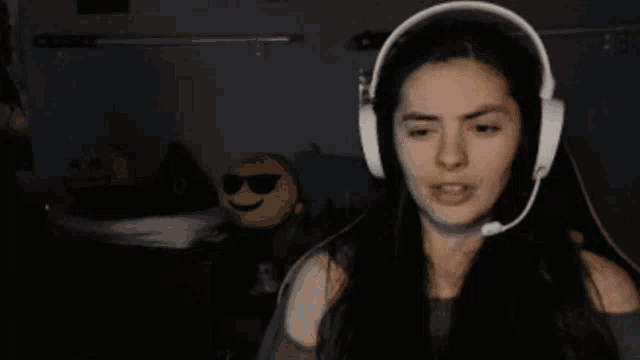 a woman wearing headphones with the words " you turned her against me " above her