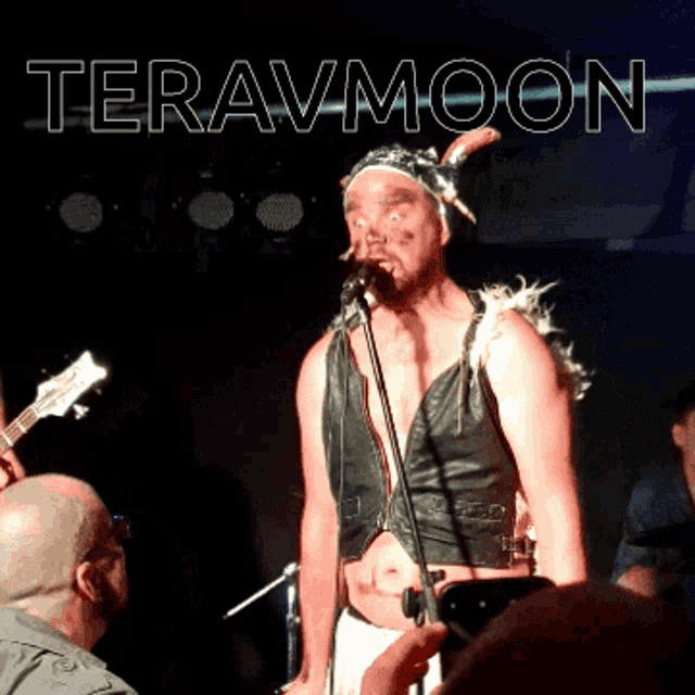 a man singing into a microphone with the word teravmoon on the bottom