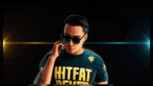 a man wearing sunglasses and a shirt that says " hitfat "