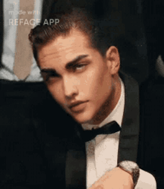 a man in a tuxedo with a watch on his wrist is made with reface app