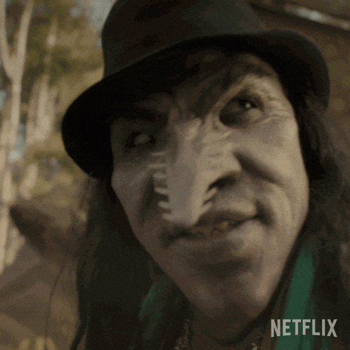 a close up of a person 's face with a netflix logo in the background