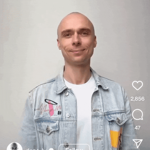 a bald man wearing a denim jacket says ' t cry ' on the screen