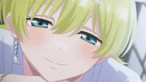 a girl with blonde hair and blue eyes is smiling with her mouth open