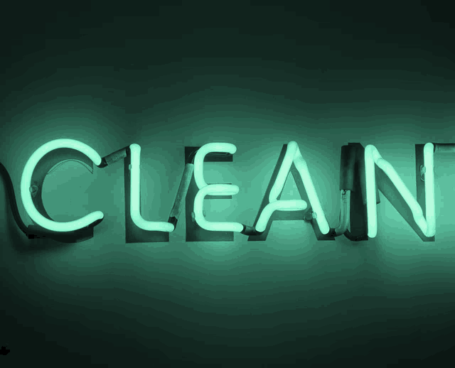 a neon sign that says clean in green