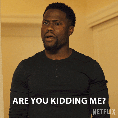 a man in a black shirt says " are you kidding me " in white letters