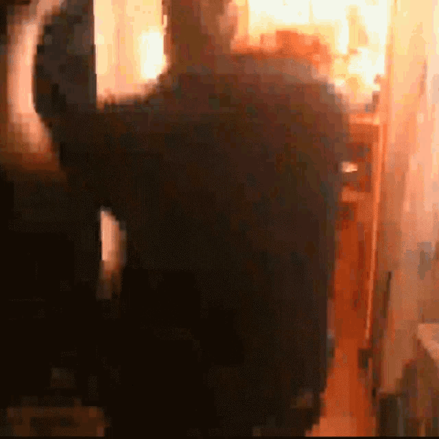a blurry picture of a man in a dark room