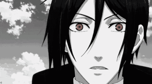 a black and white image of a man with red eyes