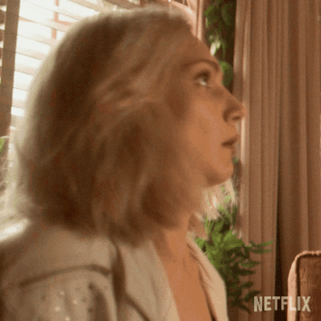 a close up of a woman 's face with the word netflix on the bottom