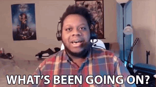 a man in a plaid shirt is asking what 's been going on