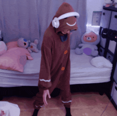 a person in a gingerbread man costume with headphones