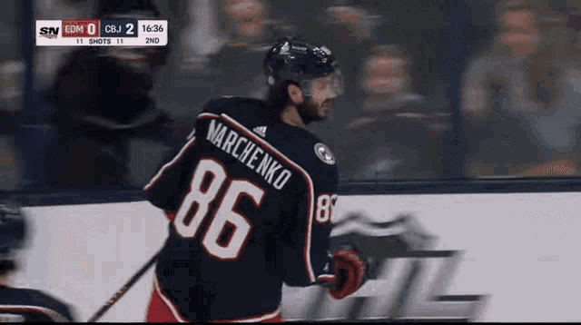 a hockey player wearing a number 86 jersey