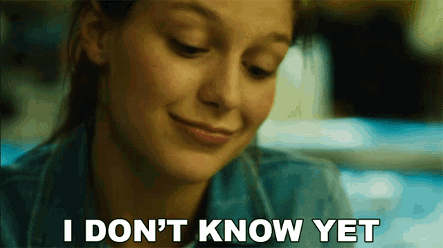 a woman says " i don 't know yet " in front of her