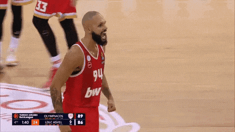a basketball player in a red uniform with the number 94 on it