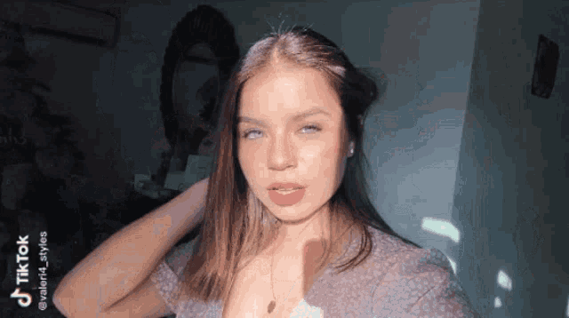 a woman 's face is shown with a tiktok watermark