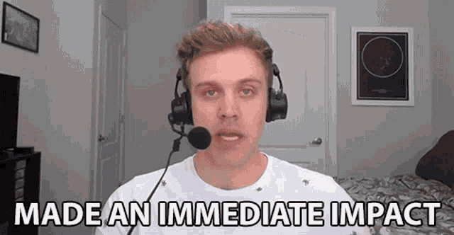 a man wearing headphones and a microphone says made an immediate impact
