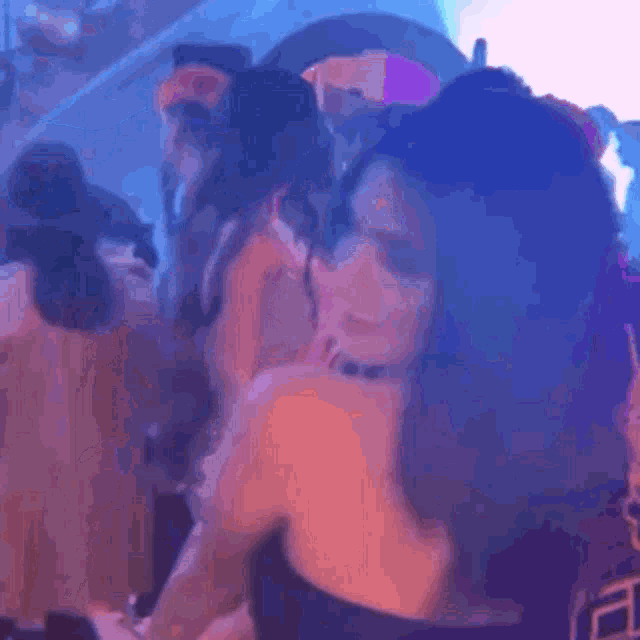 a blurry picture of a woman sticking her tongue out
