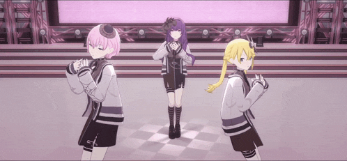 a group of anime girls are dancing on a stage .