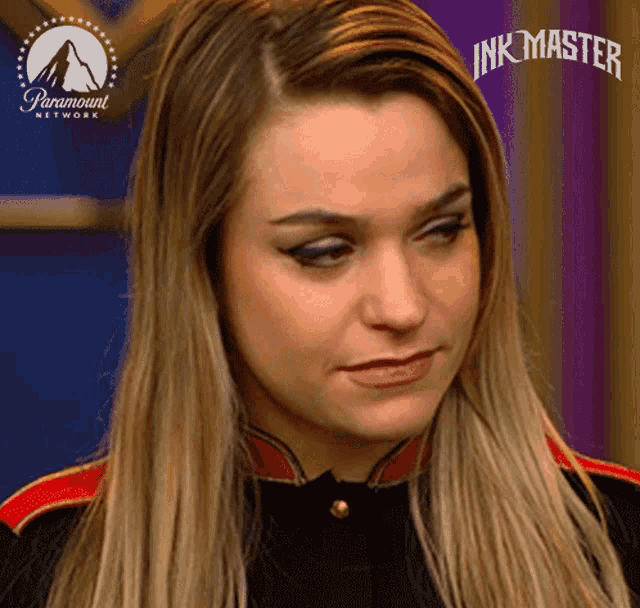 a close up of a woman 's face with the words ink master above her