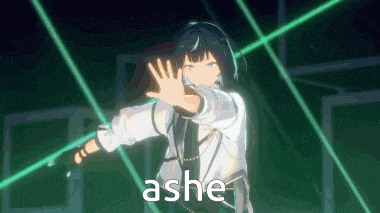 a girl in a white shirt is standing in front of a green light and making a hand gesture .