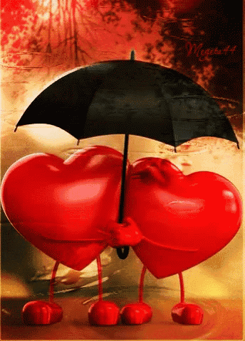 a couple of red hearts holding an umbrella with the word magic written on the bottom
