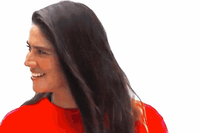 a woman with long hair wearing a red shirt