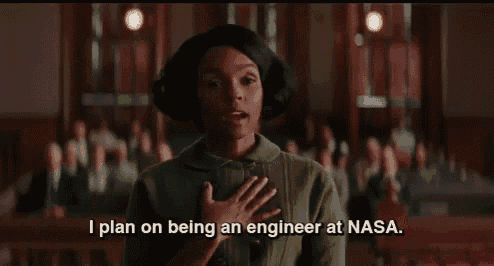 a woman is standing in front of a group of people and saying `` i plan on being an engineer at nasa . ''