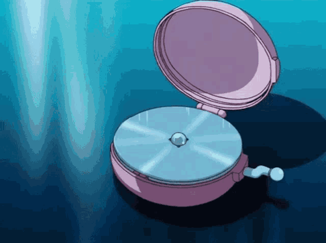 a pink clock with a blue disc inside of it