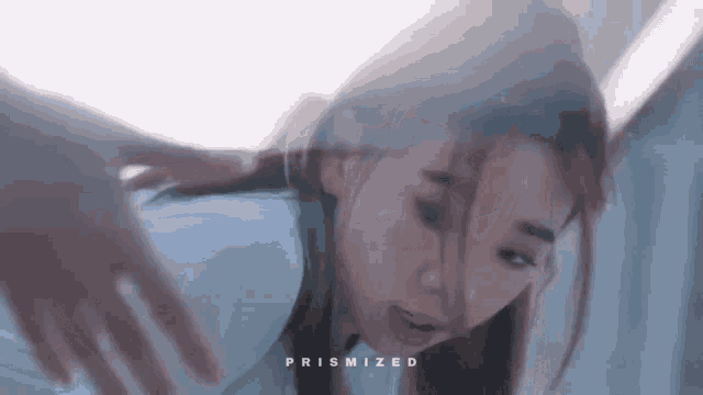 a close up of a woman 's face with the word prismized written on the bottom