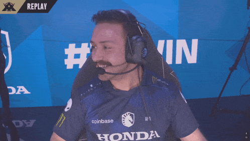 a man wearing a headset and a shirt that says honda