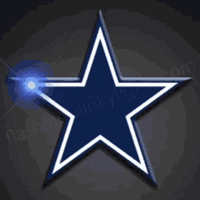 a blue and white star with a light in the middle