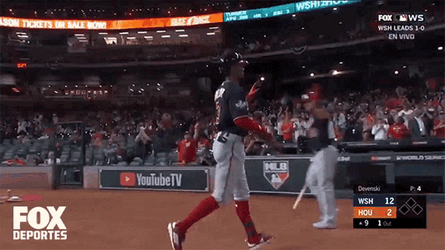a fox deportes broadcast of a baseball game with a player running