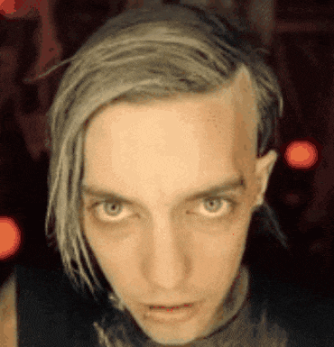 a close up of a man 's face with gray hair