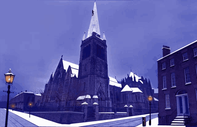 a large building with a steeple is surrounded by snow covered buildings