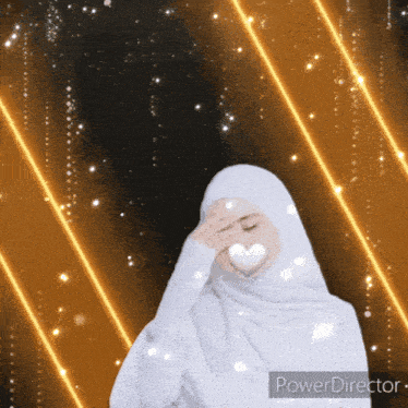a woman in a white hijab covering her face with her hand with a heart in her hand