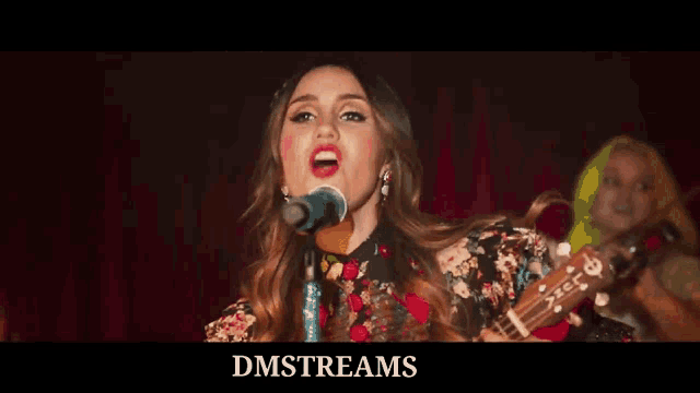 a close up of a person playing a guitar with the words dmstreams written below them