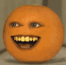 a close up of an orange with a cartoon face on it .