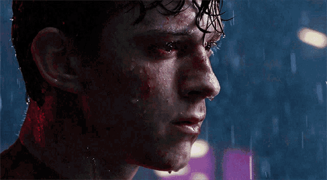 a close up of a man 's face with blood coming out of it