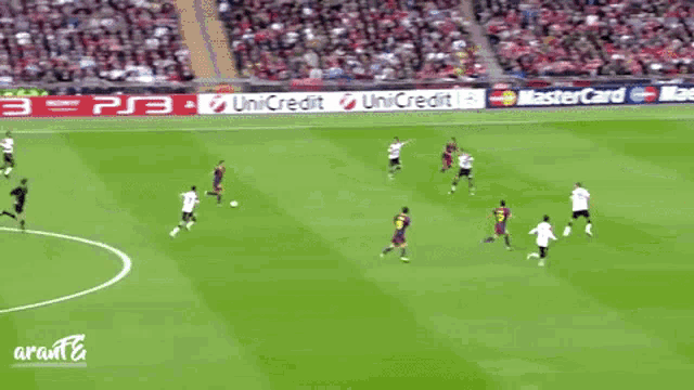a soccer game is being played in a stadium with advertisements for pepsi and new focus