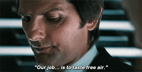a man in a suit is saying " our job is to taste free air "