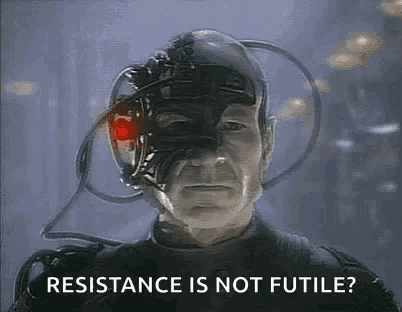 a man with a robotic head is asking if resistance is not futile