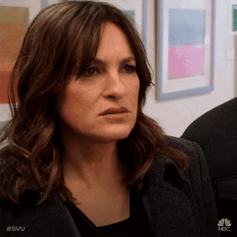 a close up of a woman 's face with #svu written on the bottom