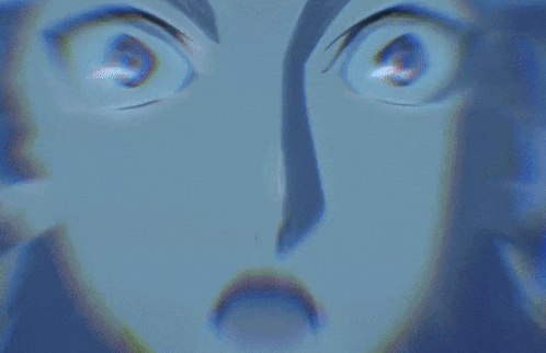 a close up of a person 's face with a surprised look on her face