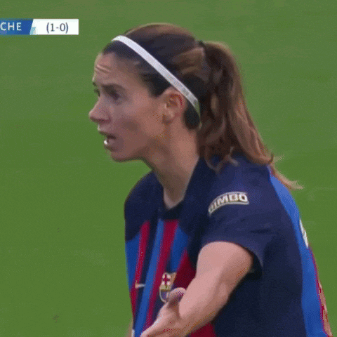 a female soccer player wearing a shirt that says spotify on it